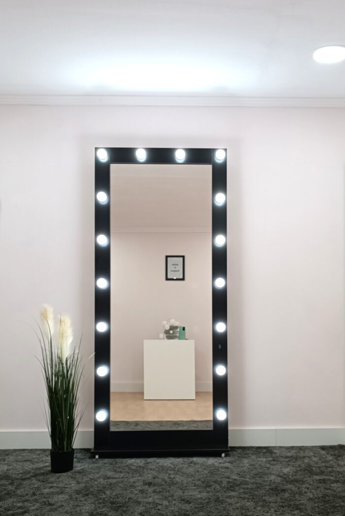 Mirror with black frame and stand